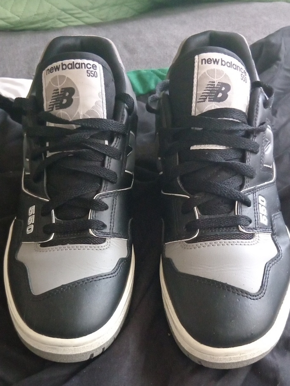 New Balance 550 Shadow sneakers featuring a black and gray leather